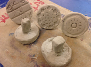 TN-completed clay stamp designs